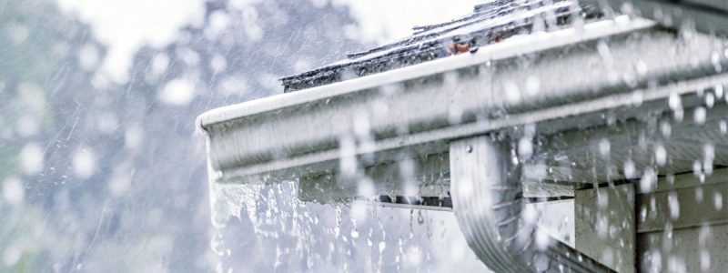 water pouring off a roof
